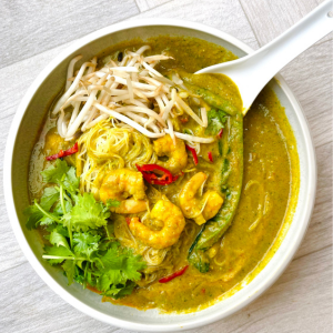 Bowl of prawn laska made using Smarter Naturally broccoli soup