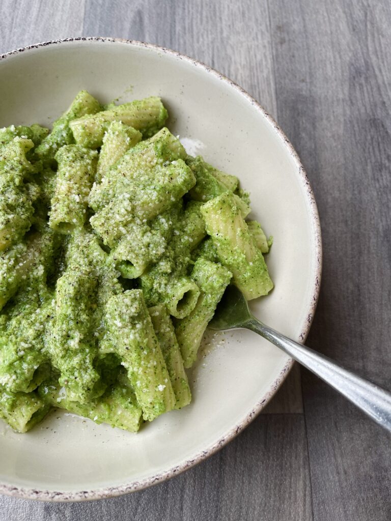 Bowl of basil cashew nut pasta with smarternaturally broccoli soup