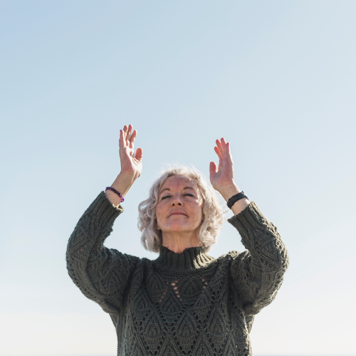 low-angle-woman-meditating-outdoors centered